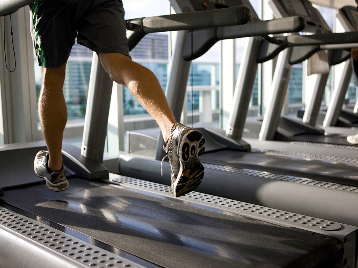 Runner's shoes on a treadmill belt